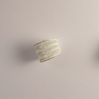 Silver ring in weaving filigree