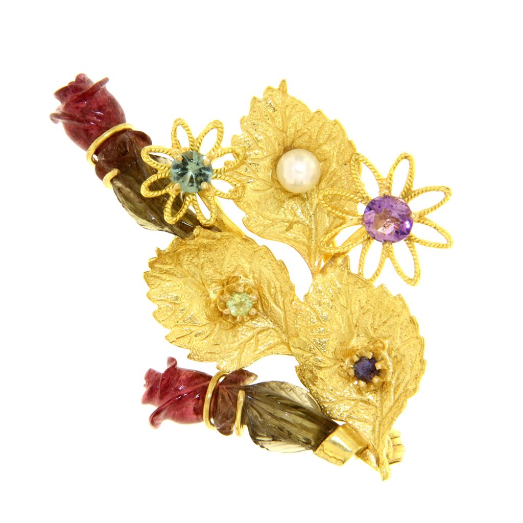 Gold brooch with precious stones