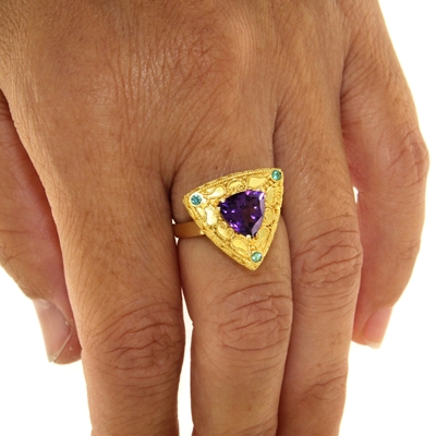 Gold ring with amethyst and emeralds