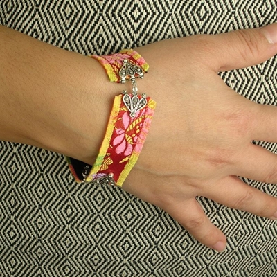 Silver filigree bracelet with brocade.