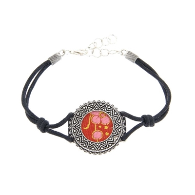 Silver filigree bracelet with red brocade