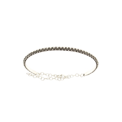 Silver rigid bracelet with honeycomb decoration