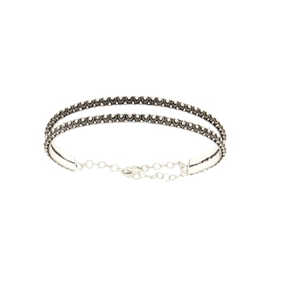 Silver rigid bracelet with honeycomb decoration