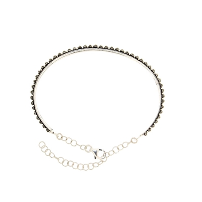 Silver rigid bracelet with honeycomb decoration
