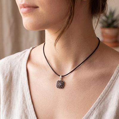 Silver filigree pendant with blue agate