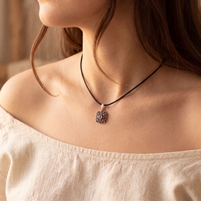 Silver filigree pendant with amethyst