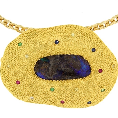 Gold pendant with precious stones and gold chain