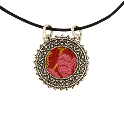 Silver  filigree pendant with red brocade