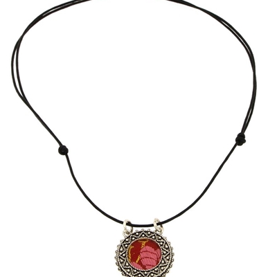 Silver  filigree pendant with red brocade