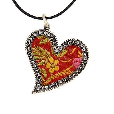 Silver heart pendant with red brocade